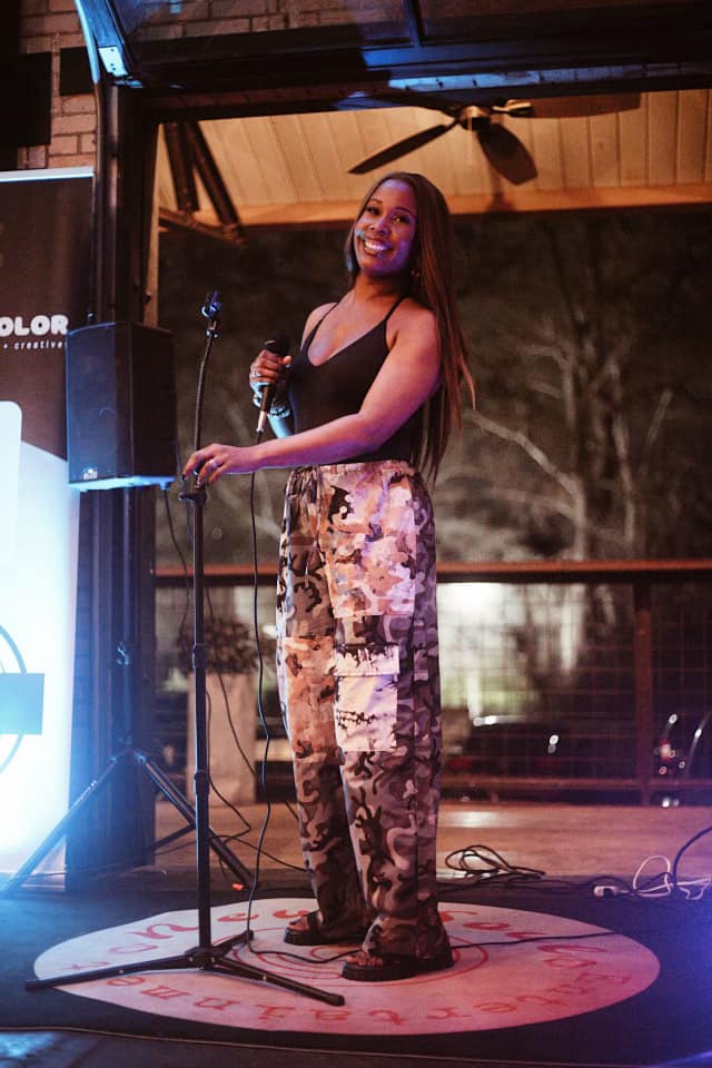 Vocalist hosting an outdoor evening event