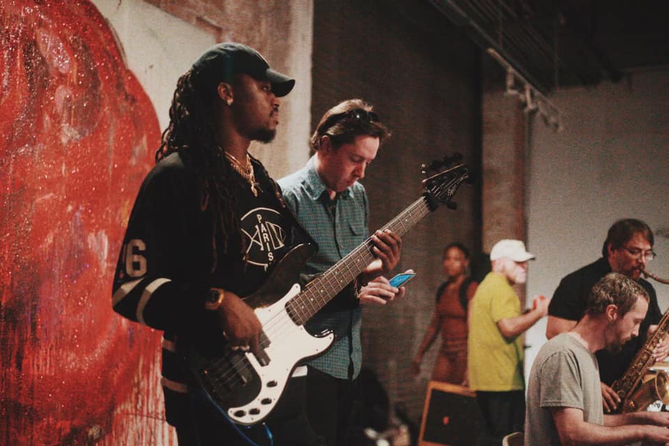 Live band performing — bass and guitar