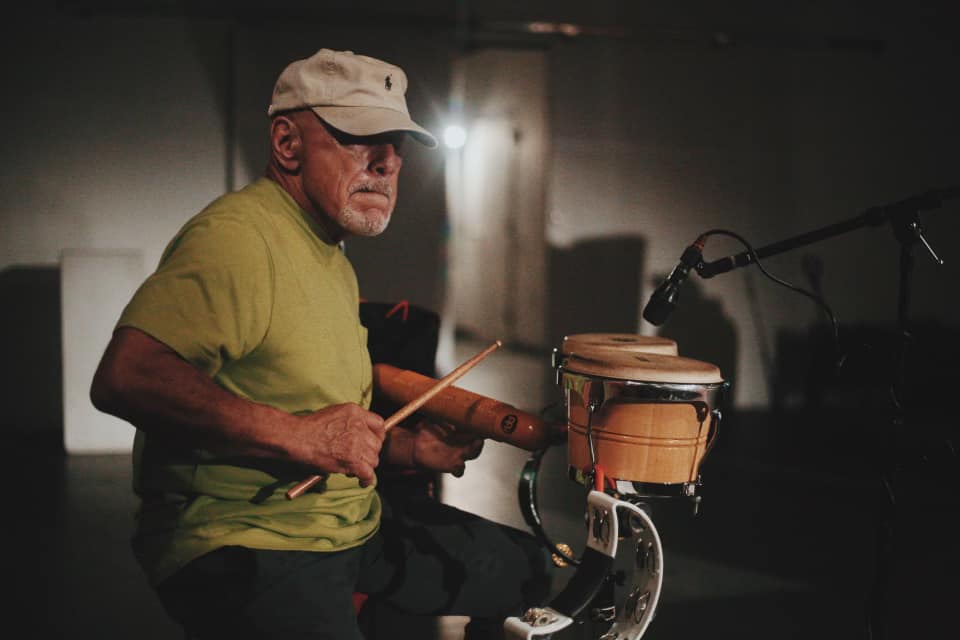 Percussionist playing congas during a live set