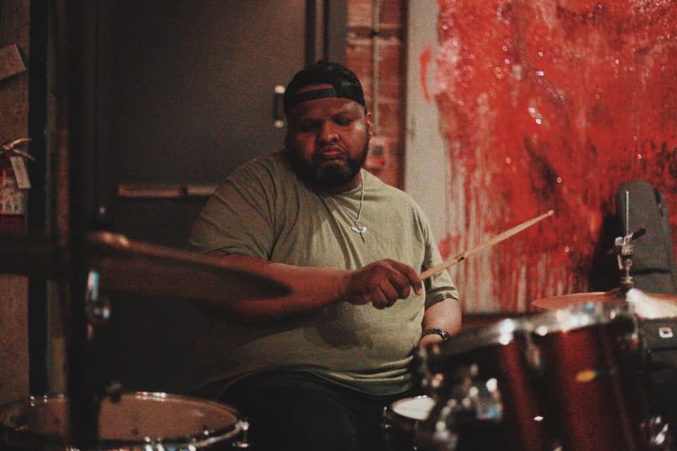 Drummer playing during a live show